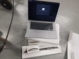 a laptop computer sitting on top of a box on a table