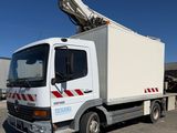 a white truck with a crane on the back of it