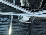a camera that is hanging from the ceiling of a building