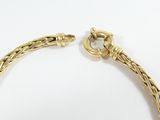 a close up of a gold bracelet with a clasp on a white surface