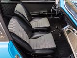 a picture of the interior of a car with a checkered seat cover