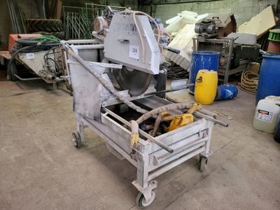 a machine that is sitting in a garage with other items