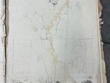an old book with a drawing of a man holding a sword