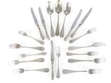a lot of forks and spoons arranged in the shape of a circle