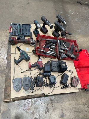 a lot of tools that are laying out on the floor