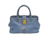 un sac à main en cuir bleu avec des finitions dorées sur la poignée