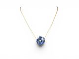a necklace with a blue flower on a gold chain