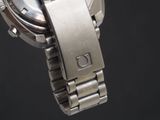 a close up of a watch on a metal bracelet