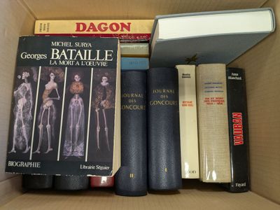 many books in a box that are sitting on top of each other