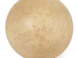 a brown ball on a white surface with a white background