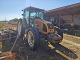a tractor that is parked in a field