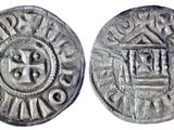 une pièce d'argent sur laquelle figure l'image d'une couronne