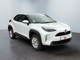 a white toyota c - hr suv parked in a showroom