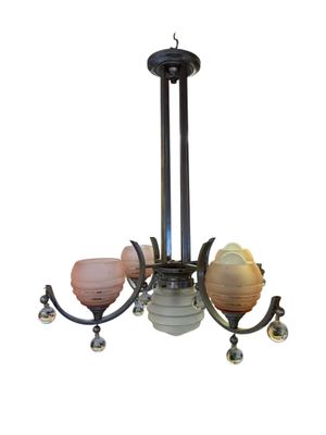 an image of a chandelier with a glass shade hanging from it