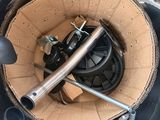 a metal bucket with a metal handle inside of it