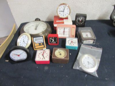many different types of clocks on the table