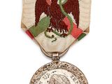 a close up of a medal with an eagle on it