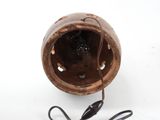 a small brown object with a cord attached to it