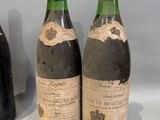 three bottles of wine sitting next to each other on a table