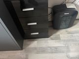a black cabinet with a phone on top of it