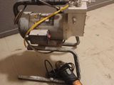 a machine that is sitting on the floor next to the wall