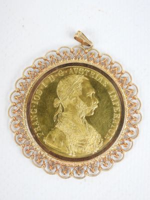l'image d'une pièce d'or sur laquelle figure le visage d'une femme