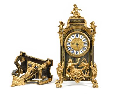 two clocks that are sitting side by side on a white surface