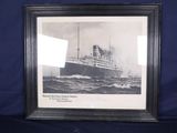 an old picture of a ship in the ocean with a black frame