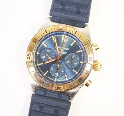 a close up of a watch on a white surface