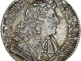 Pièce d'argent portant l'image d'un homme portant une couronne.