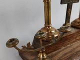 three candles that are sitting on a wooden table