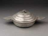 bowl with lid made of silver metal with a decorative design