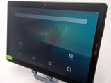 the tablet is sitting on a stand on a white surface