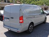 a silver van that is parked in a parking lot