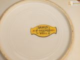 a white plate with a yellow label on it