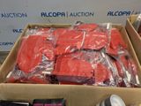 a box full of red items that are sitting on the floor