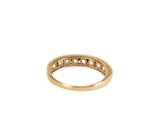 a close up of a gold ring on a white background