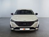 the front view of a white car in a white room