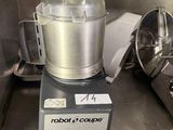 a silver blender sitting on top of a metal counter