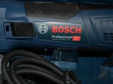 a bosch corded drill with a cord attached to it