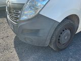 a white van that is parked on the side of the road