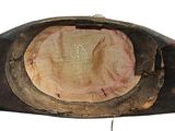 an old hat with a hole in the middle of it