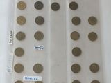 a lot of coins in a plastic bag on a table