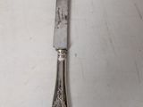 a knife that is laying on a table