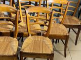 a lot of chairs that are lined up in a room