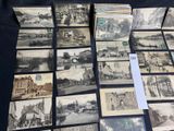 a lot of old black and white photos on the table