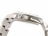 a close up of a watch with a diamond on it
