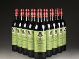 six bottles of red wine are lined up in a row