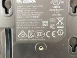 a close up of a metal device with a button on it