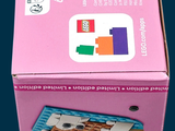 a pink box with a picture of a teddy bear on it